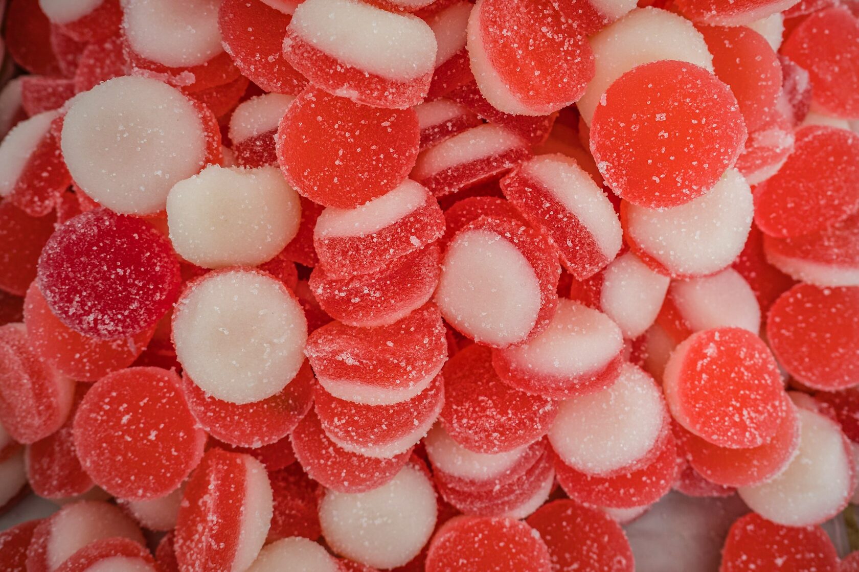 A round pink Coin Volcano raspberry candy