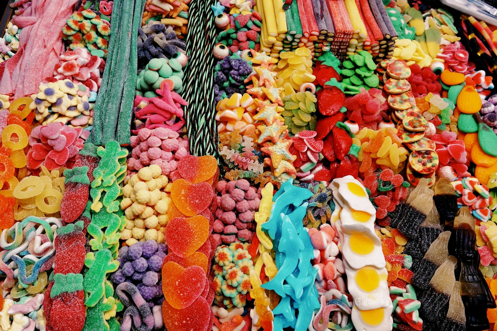 Colourful fresh fruits and candy-making ingredients used to create Coin Volcano