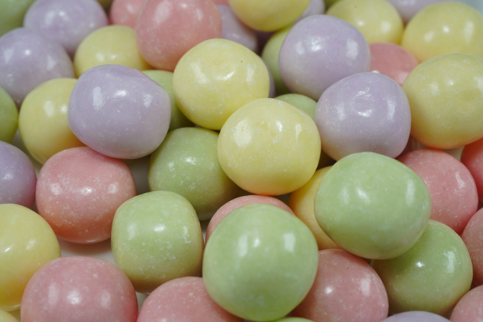 A round purple Coin Volcano blueberry candy