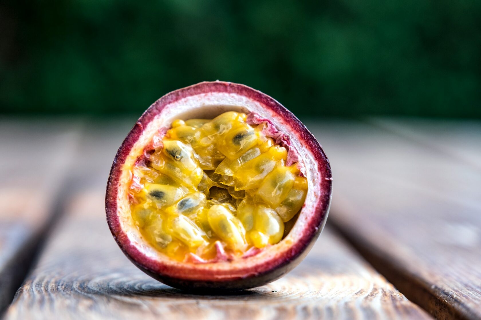 A round tropical-orange Coin Volcano passion fruit candy