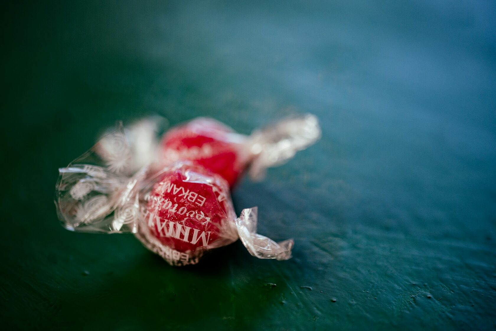 A round deep-red Coin Volcano cherry candy